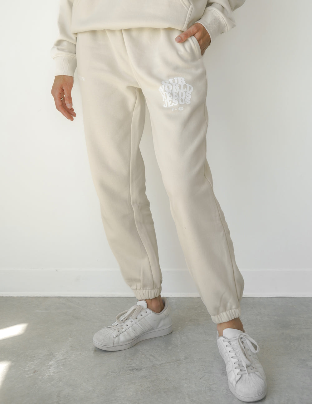 Our World Needs Jesus Beige Unisex Sweatpant – Christian Sweatpant