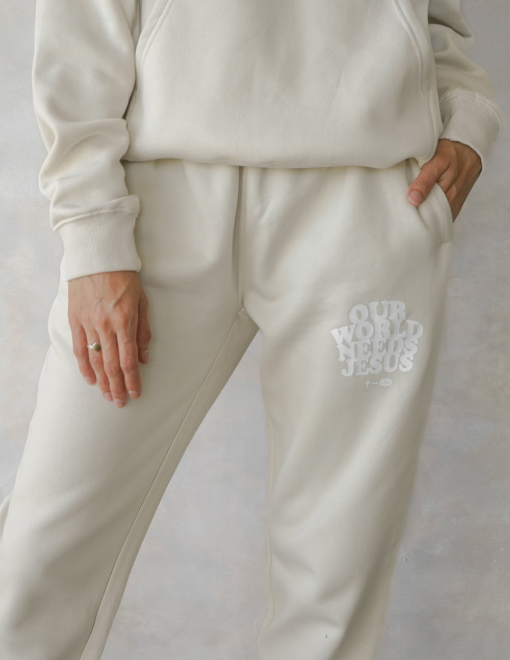 Our World Needs Jesus Beige Unisex Sweatpant – Christian Sweatpant