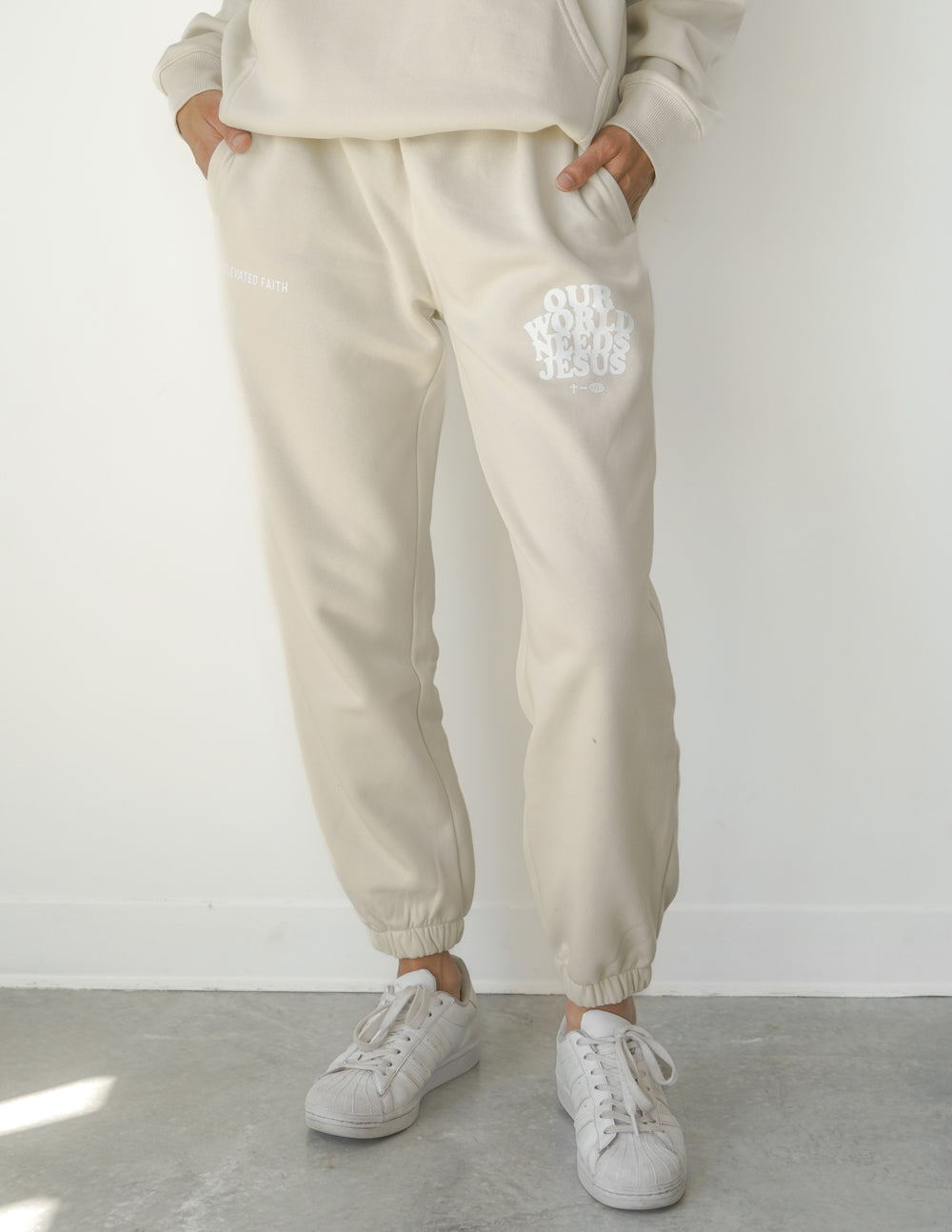 Our World Needs Jesus Beige Unisex Sweatpant – Christian Sweatpant