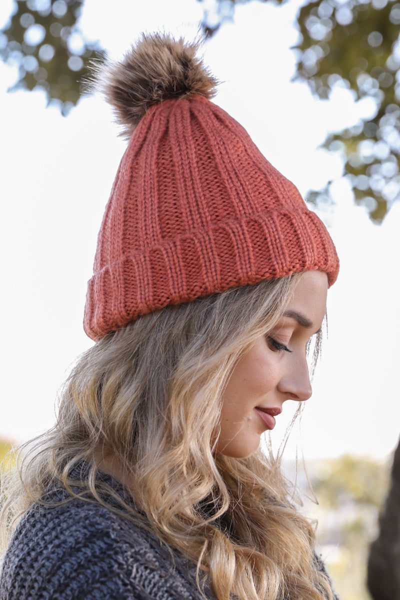 Leto Collection basic ribbed pom beanie in persimmon orange, featuring a cozy knit design and a pom pom on top.