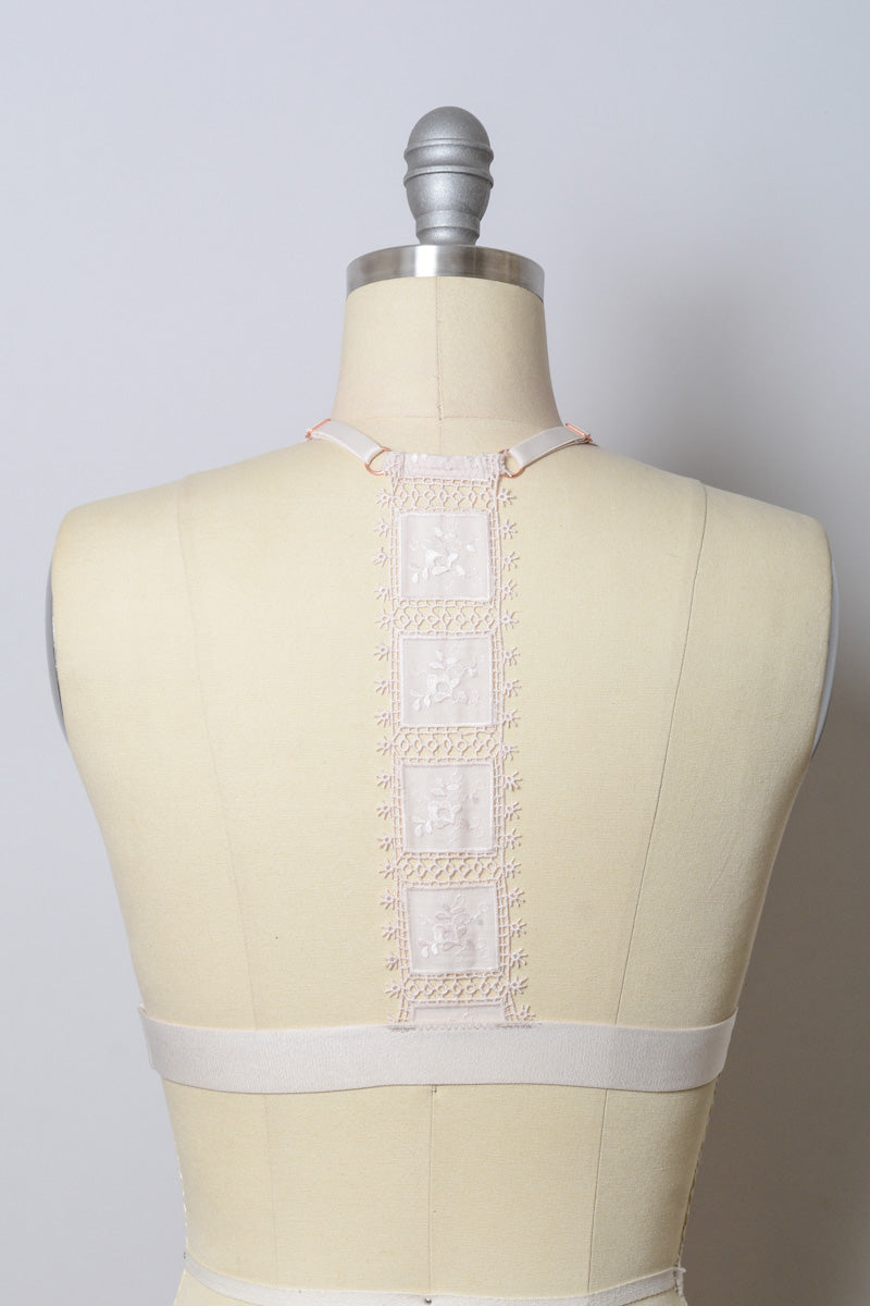 Leto Collection crochet T-back bralette in natural color, featuring intricate knit design and comfortable fit.
