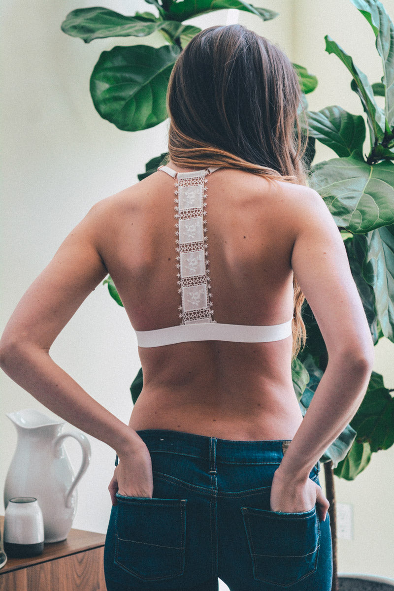 White crochet T-back bralette by Leto Collection, featuring delicate crochet details and a comfortable fit.