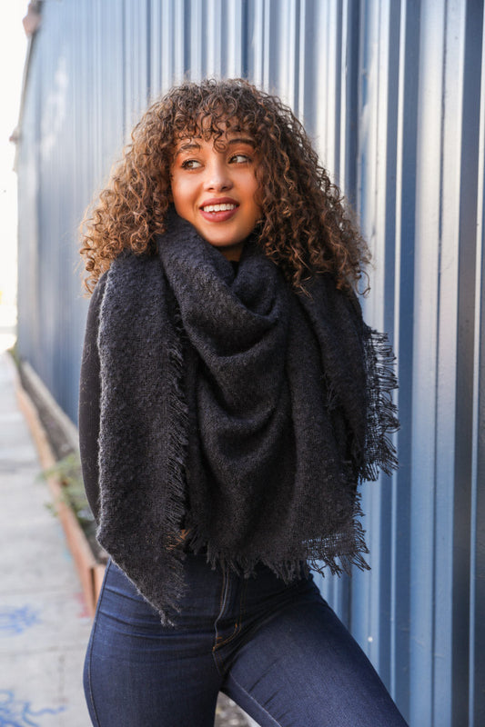 Black mohair square blanket scarf from Leto Collection, showing soft, cozy fabric with a stylish checkered pattern.