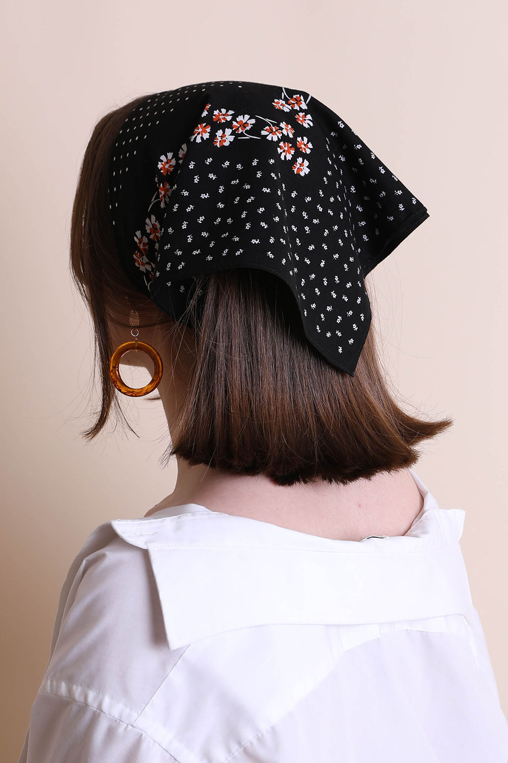 Black dotted and floral bandana from Leto Collection, featuring vibrant patterns and lightweight fabric.