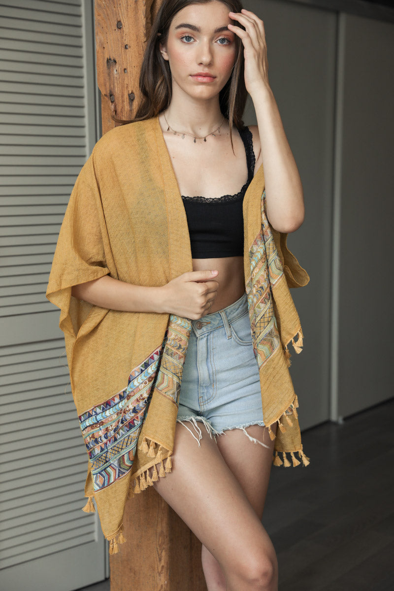 Yellow embroidered geometric kimono by Leto Collection, featuring intricate patterns and lightweight fabric.