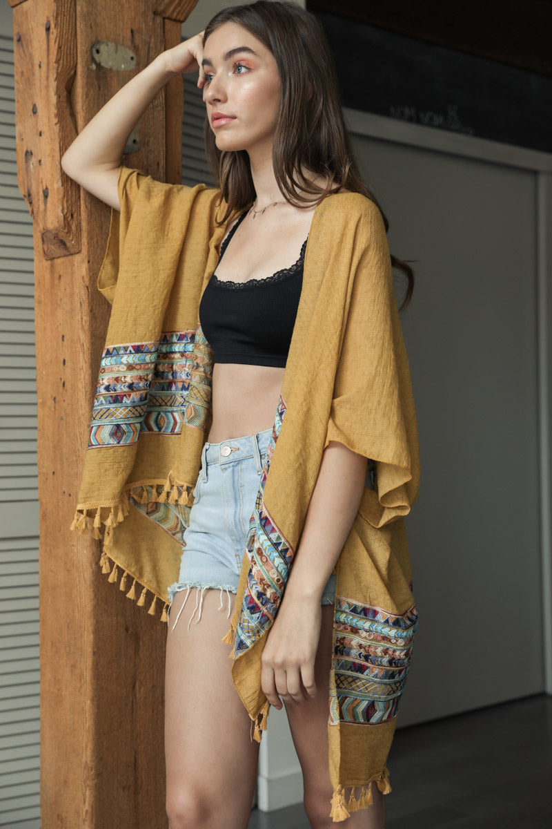 Leto Collection embroidered geometric kimono in mustard color, featuring intricate patterns and lightweight fabric.