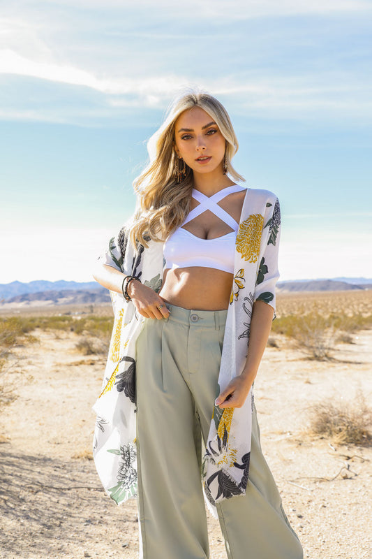 Small white Leto Collection cross strap bralette with stylish adjustable straps and soft fabric, perfect for comfortable wear.