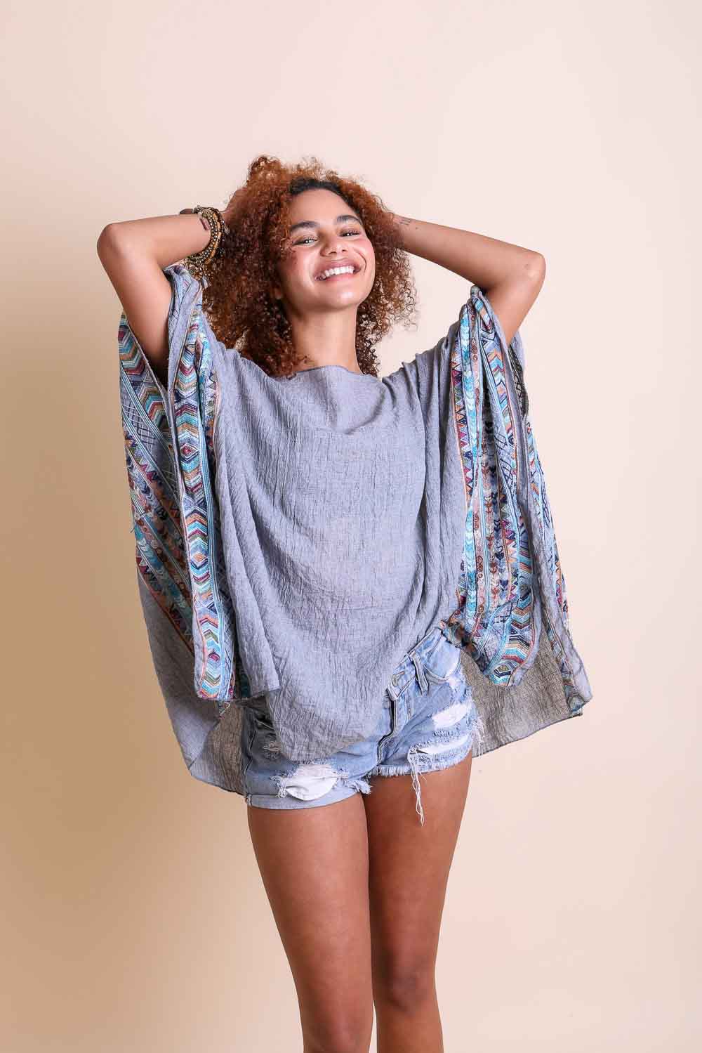 Leto Collection geometric embroidered kimono tunic with intricate patterns and vibrant colors, displayed on a neutral background.