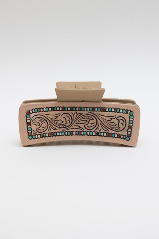 Leather Swirl Hair Claw with tribal pattern and clam clip design.
